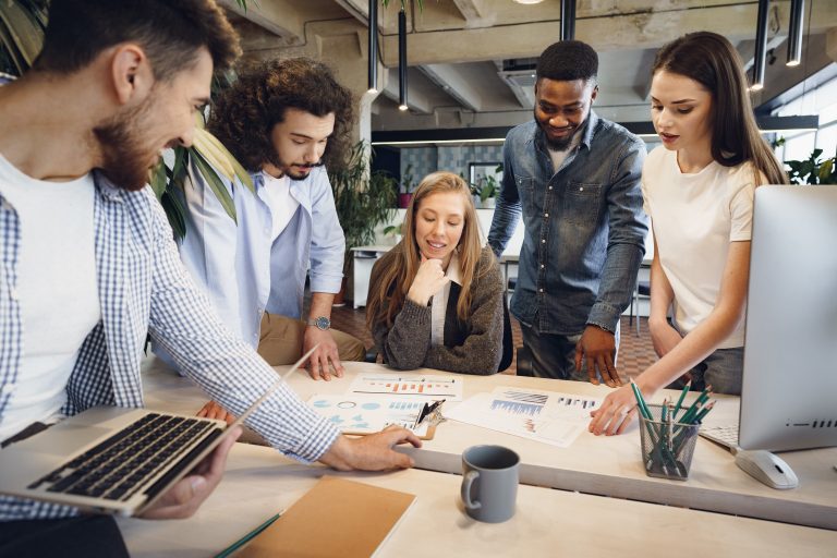 team-diverse-coworkers-modern-office-discuss-their-project-together
